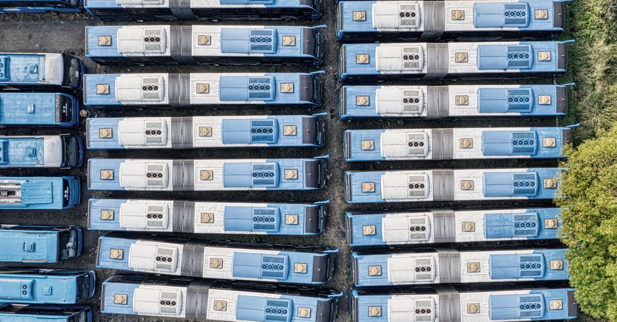 Top-down aerial view of neatly parked blue buses, South Tangerang.